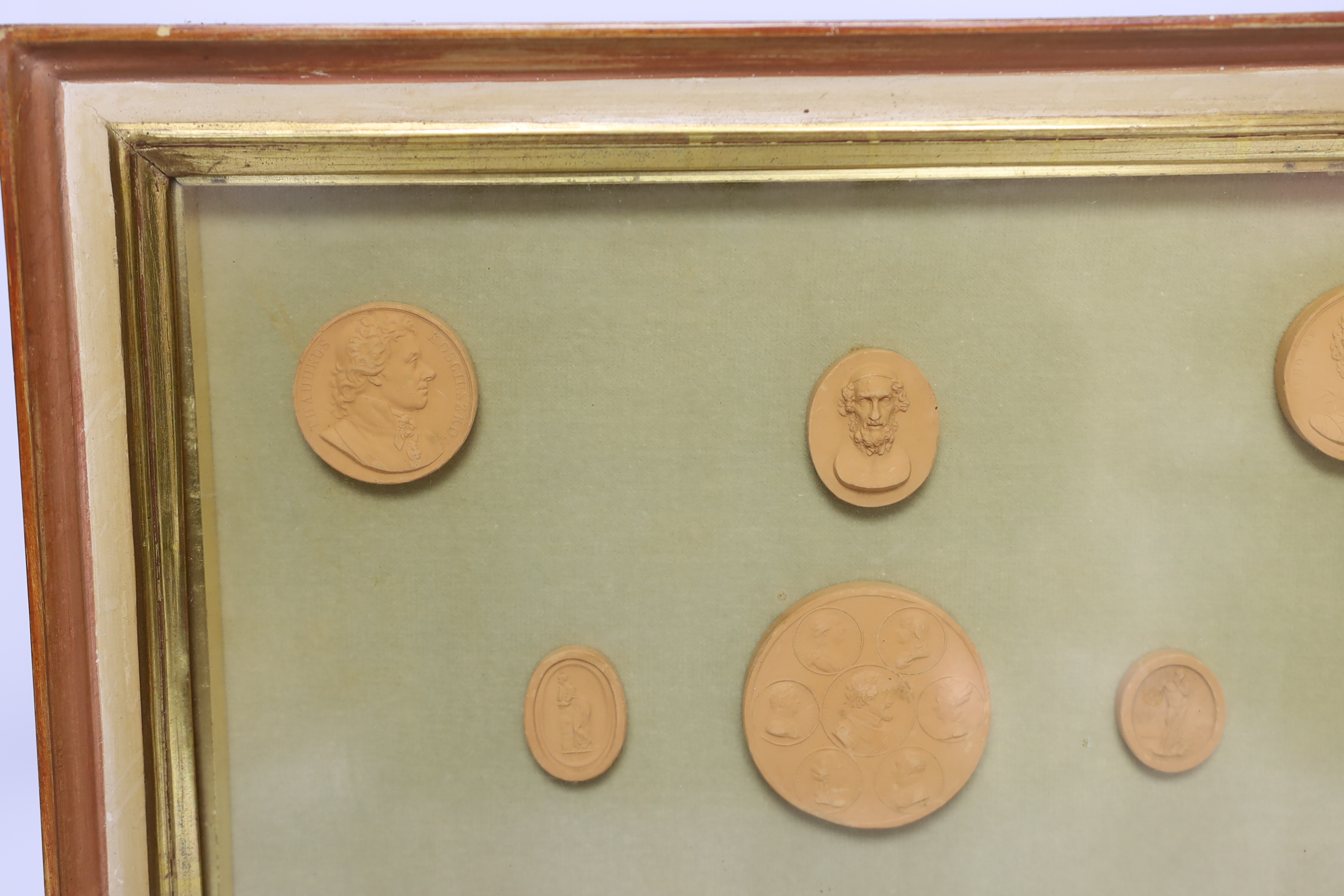 A framed set of nine grand tour medallions, 30x37cm total